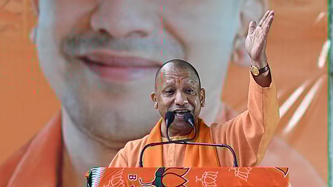Uttar Pradesh Chief Minister Yogi Adityanath addresses a public meeting for the upcoming Delhi Assembly elections, in New Delhi, Thursday.