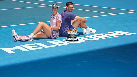 Olivia Gadecki and John Peers of Australia pose with their trophy after the mixed doubles final at the Australian Open tennis championship in Melbourne, Australia, Friday, Jan. 24, 2025.