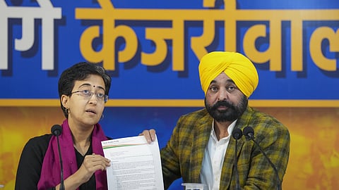 Delhi Chief Minister Atishi and her Punjab counterpart Bhagwant Mann address a press conference, in New Delhi, Friday, Jan. 24, 2025.