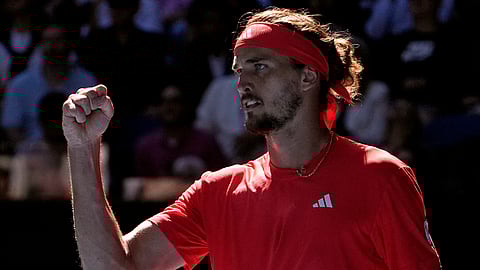 Alexander Zverev of Germany reacts after winning the first set in his semifinal match against Novak Djokovic of Serbia at the Australian Open tennis championship in Melbourne, Australia, Friday, Jan. 24, 2025.