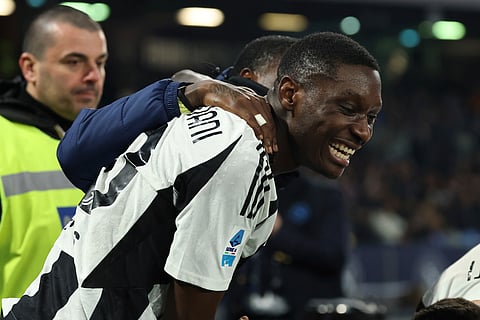 Juventus' Randal Kolo Muani, center, celebrates after scoring the team's first goal during the Serie A soccer match between Napoli and Juventus at the Diego Armando Maradona Stadium in Naples, Italy, Saturday Jan. 25, 2025. 