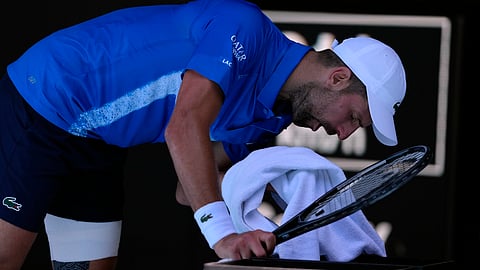 Novak Djokovic of Serbia reacts during his semifinal match against Alexander Zverev of Germany at the Australian Open tennis championship in Melbourne, Australia, Friday, Jan. 24, 2025.