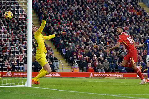 Liverpool's Cody Gakpo heads the ball to score his side's fourth goal during the English Premier League soccer match between Liverpool and Ipswich Town at Anfield Stadium in Liverpool, Saturday, Jan. 25, 2025.
