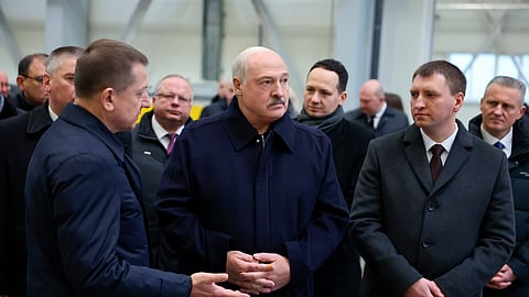In this photo released by Belarus' Presidential Press Service, President Alexander Lukashenko, center, visits the Minsk Automobile Plant in Minsk, Belarus, Jan. 21, 2025.
