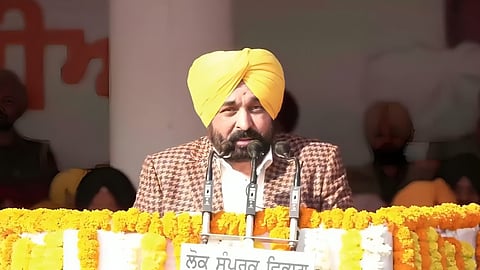 Punjab Chief Minister Bhagwant Mann addressing the gathering after unfurling the national tricolour at the 76th Republic Day function in Patiala's Polo Ground.