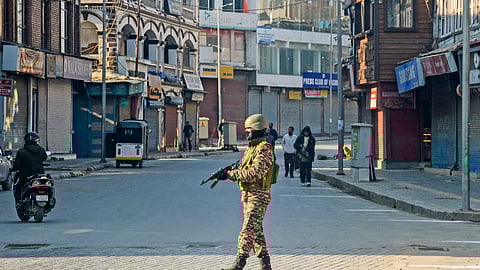 Security personnel keeps vigil during celebrations of the 76th Republic Day, in Srinagar, Sunday.