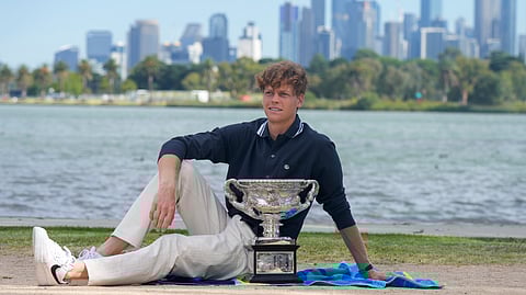 Jannik Sinner of Italy poses with Norman Brookes Challenge Cup the morning after defeating Alexander Zverev of Germany in the men's singles final at the Australian Open tennis championship in Melbourne, Australia, Monday, Jan. 27, 2025.