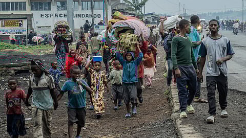 People displaced by the fighting with M23 rebels make their way to the center of Goma, Democratic Republic of the Congo, Sunday, Jan. 26, 2025. 