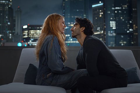 This image released by Sony Pictures shows Justin Baldoni, right, and Blake Lively in a scene from "It Ends With Us." 