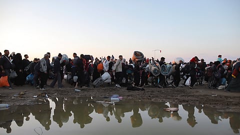 Displaced Palestinians arrive in the northern Gaza Strip, following Israel's decision to allow thousands of them to go back for the first time since the early weeks of the 15-month war with Hamas, Monday, Jan. 27, 2025.