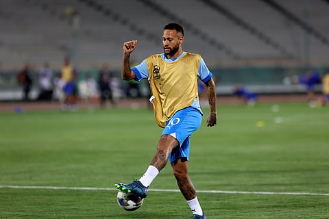 Al Hilal's Neymar shoots the ball during warm up for the AFC Champions League soccer match against Iran's Nassaji at the Azadi Stadium