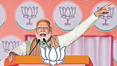 Prime Minister Narendra Modi addresses a public meeting ahead of the Delhi Assembly elections, at Kartar Nagar in New Delhi on Wednesday.