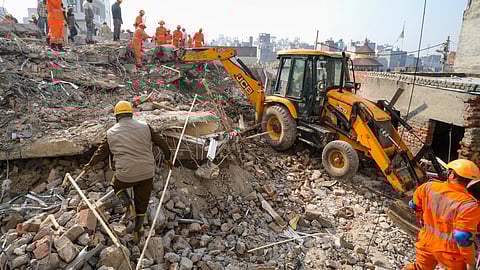 Rescue work underway after a four-storey building collapsed, at Burari area, in New Delhi, Tuesday, Jan. 28, 2025. At least two people were killed in the incident, according to police.