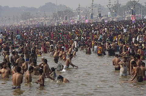 Devotees take a holy dip at the Sangam during the ongoing Maha Kumbh Mela, in Prayagraj, Thursday, Jan. 30, 2025. 