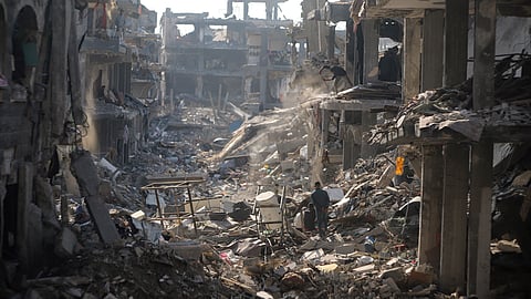 Palestinians inspect their homes destroyed by Israeli attacks in Jebaliya, northern Gaza Strip, Wednesday, Jan. 29, 2025. 