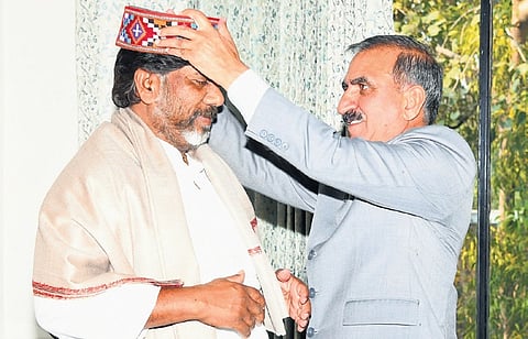 Himachal Pradesh Chief Minister Sukhvinder Singh Sukhu presents a traditional Himachal cap to Telangana Deputy CM Mallu Bhatti Vikramarka on Thursday.
