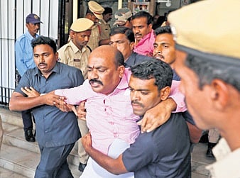 BRS corporators being evicted by marshals from the GHMC council hall on Thursday 
