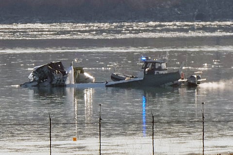 Search and rescue efforts are seen around a wreckage site in the Potomac River from Ronald Reagan Washington National Airport, early Thursday morning, Jan. 30, 2025, in Arlington