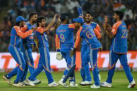India celebrate the wicket of England's Jos Buttler on Friday
