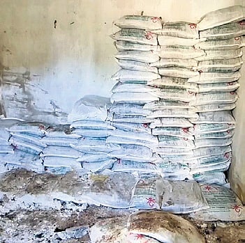 Damaged bleaching powder bags piled in municipality stockyard 