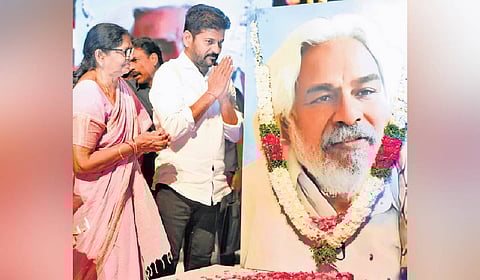 Chief Minister A Revanth Reddy pays floral tributes to a portrait of Gaddar on his birth anniversary at Ravindra Bharathi in Hyderabad on Friday.