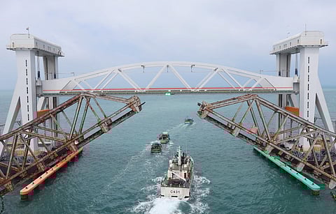 Center lift span of both old and new Pamban railway bridge was lifted for coast guard ships to cross in Ramanathapuram on Friday.