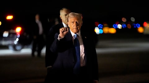 US President Donald Trump gestures as he arrives at Palm Beach International Airport in West Palm Beach, Fla., Friday, Jan. 31, 2025, en route to his Mar-a-Lago estate in Palm Beach.