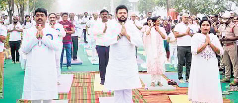 Civil Aviation Minister Kinjarapu Ram Mohan Naidu and Srikakulam MLA Gondu Shankar performing Surya Namaskar along with 5,000 people 