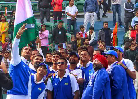 Indian players rejoice after winning their tie against Togo in New Delhi on Sunday