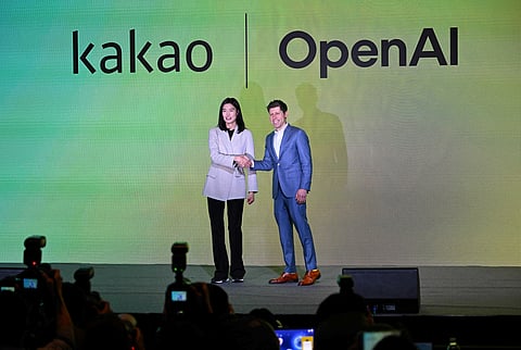 Open AI CEO Sam Altman (R) and Kakao CEO Chung Shin-a (L) pose for photos during a press conference at a hotel in Seoul on Tuesday.