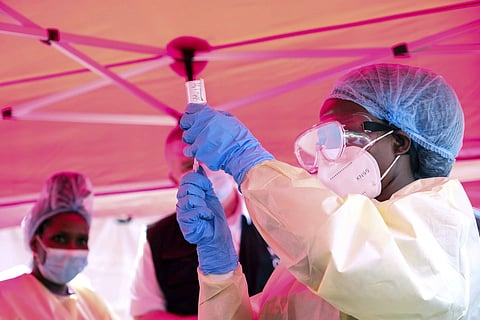 A health worker prepares to administer a vial of vaccine against the Sudan strain of Ebola, during a trial, at Mulago Referral Hospital, in Kampala, Uganda, Monday, Feb 3, 2025.
