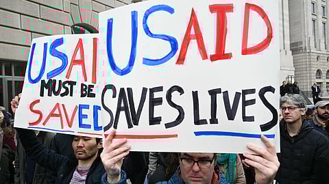 People protest outside of the headquarters for United States Agency for International Development (USAID)