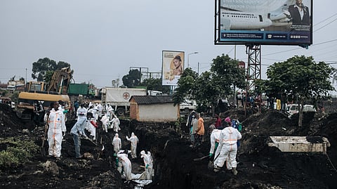 Members of the Congolese Red Cross and Civil Protection bury dozens of victims of the recent clashes in a cemetery in Goma on February 4, 2025.
