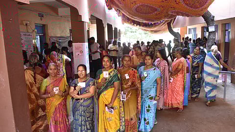 People lined up to cast their vote for Erode east constituency by election at polling booth in Erode on Wednesday.