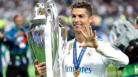 Real Madrid's Cristiano Ronaldo celebrates with the trophy after winning the Champions League Final soccer match between Real Madrid and Liverpool at the Olimpiyskiy Stadium in Kiev, Ukraine, Saturday, May 26, 2018.