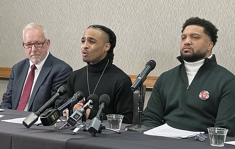 Robert Brooks Jr. speaks during a press conference as his lawyer Steve Schwarz, left, and Jared Ricks listen in Rochester, N.Y., Wednesday, Jan 15, 2024.