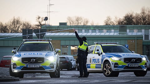 Police officers stand guard outside the adult education center Campus Risbergska school in Orebro, Sweden, on February 6, 2025 two days after a shooting there left eleven people dead.