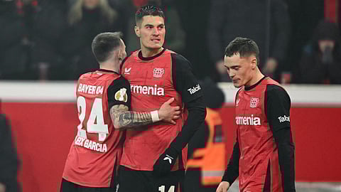 Bayer Leverkusen's Czech forward #14 Patrik Schick celebrates after scoring a goal with his teammates during the German Cup (DFB Pokal) quarter-final football match Bayer 04 Leverkusen vs FC Cologne in Leverkusen, western Germany on February 5, 2025.