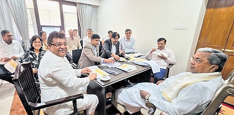 Chief Minister Siddaramaiah holds a meeting with Industries Minister MB Patil and officials in Bengaluru on Thursday.