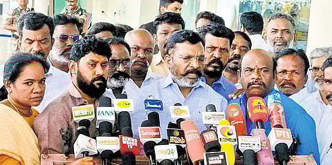 VCK chief Thol Thirumavalavan talking to reporters at Madurai airport