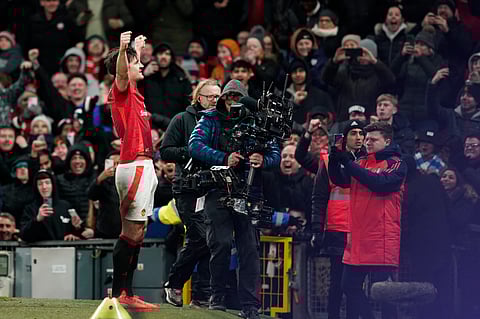 Manchester United's Harry Maguire celebrates after scoring his side's second goal during the English FA Cup fourth round soccer match between Manchester United and Leicester City at the Old Trafford stadium in Manchester, England, Friday, Feb. 7, 2025.
