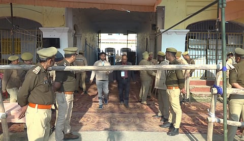 Security personnel guard at a counting centre for Milkipur bypoll in Ayodhya district, Uttar Pradesh, Saturday, Feb. 8, 2025.