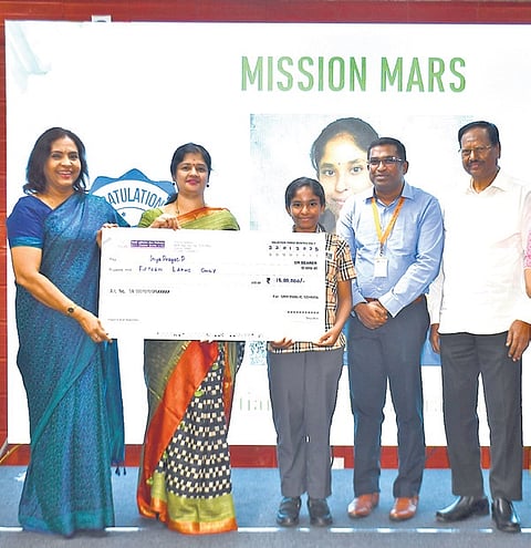 SRM Public School staff felicitating the girl, who completed the Astronaut Training Lunar Isolation Mission representing India 