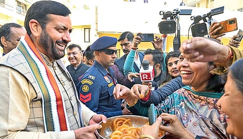 Haryana CM Nayab Saini distributes ‘jalebi’ to celebrate BJP’s win.