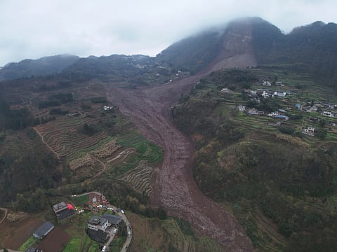 In this photo released by Xinhua News Agency, an aerial drone photo shows the site of a landslide in Jinping Village, Junlian County in the city of Yibin, southwest China's Sichuan Province, Saturday February 8, 2025.