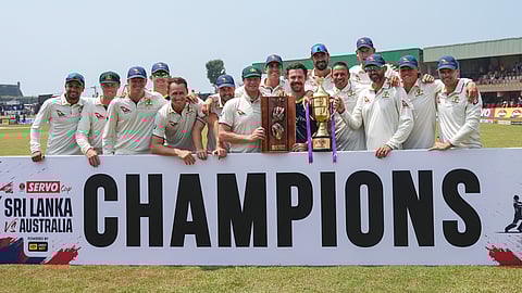 Australia's team members pose with the Warn-Muralitharan trophy at the end of second test cricket match between Sri Lanka and Australia in Galle, Sri Lanka, Sunday, Feb. 9, 2025.