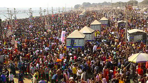 Devotees arrive to take a holy dip during the ongoing Mahakumbh Mela