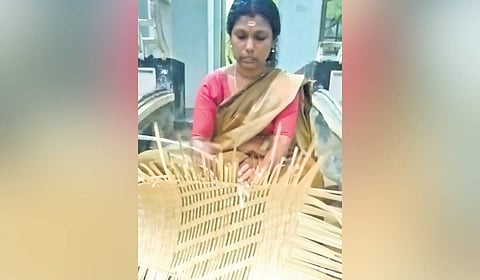 Soumya engaged in bamboo weaving at her house in ST Colony in Adimali.