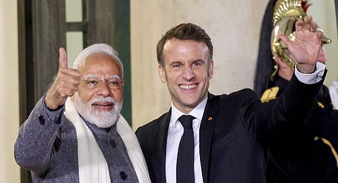 Prime Minister Narendra Modi is greeted by President of France Emmanuel Macron as he arrives for a reception at Elysee Palace in Paris on Tuesday, Feb. 11, 2025. 