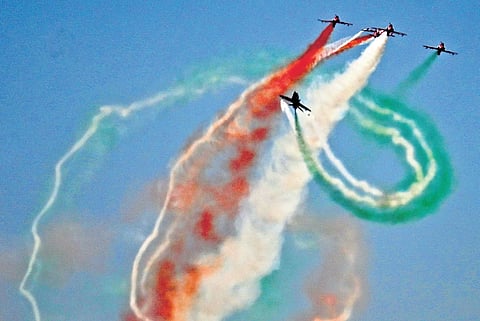 Surya Kiran Aerobatic Team in action in Aero India 2025 at Yelahanka Air Force Station in Bengaluru on Tuesday.